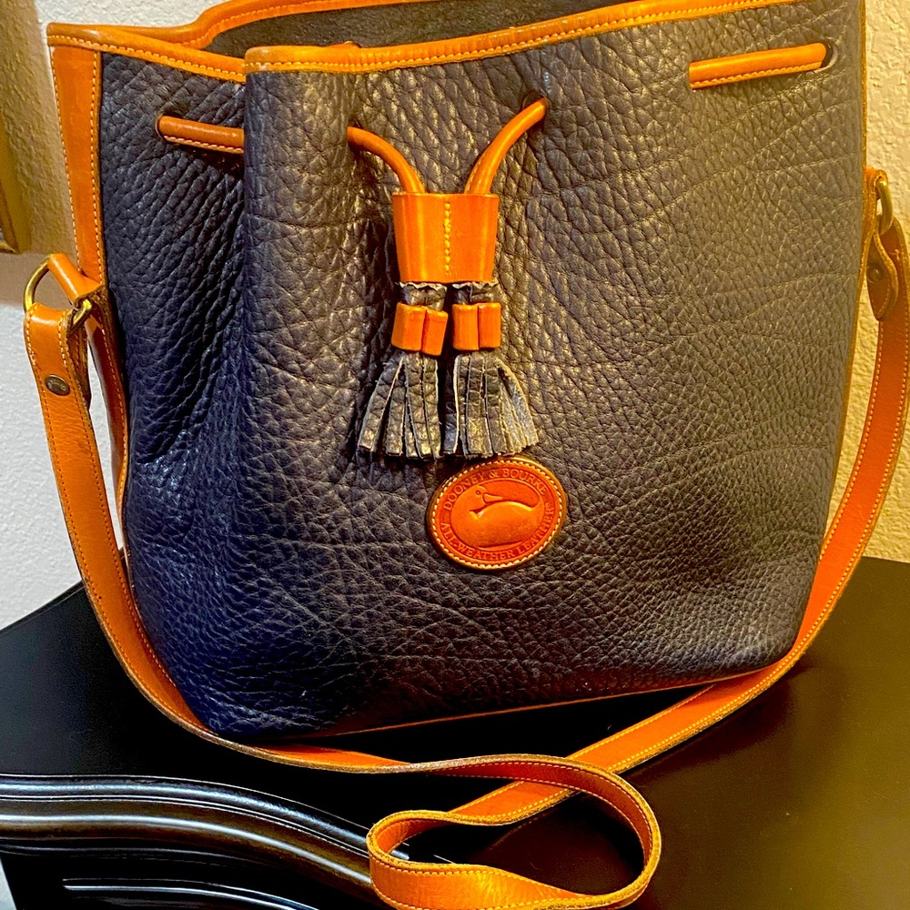 Dooney & Bourke navy with camel trim shoulder bag.